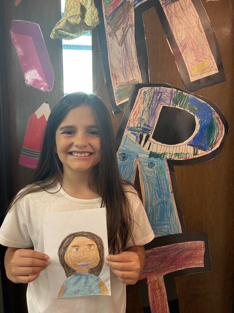 Student with drawing of herself