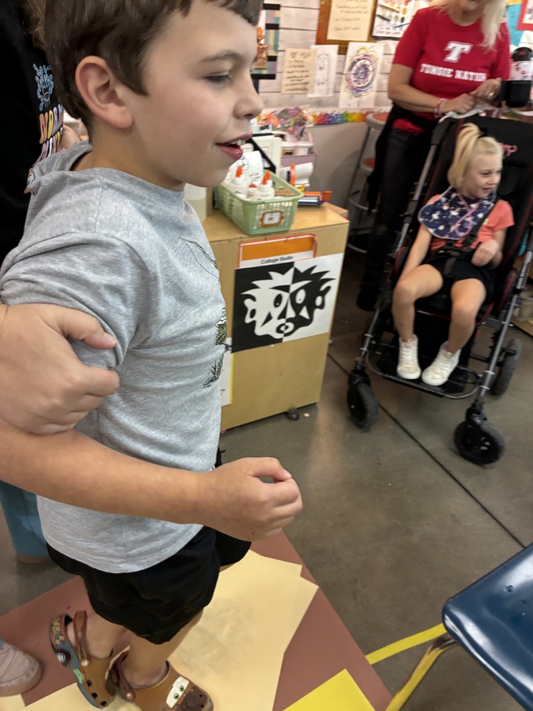 boy walking on paint and paper