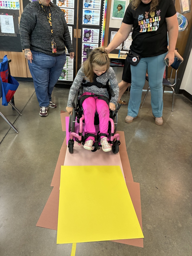 girl in wheel chair with pink pants