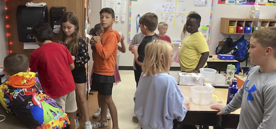 Students in Ms. Mecklers' 3rd grade classroom learn about metric capacity by measuring and comparing milliliters and liters of water. 