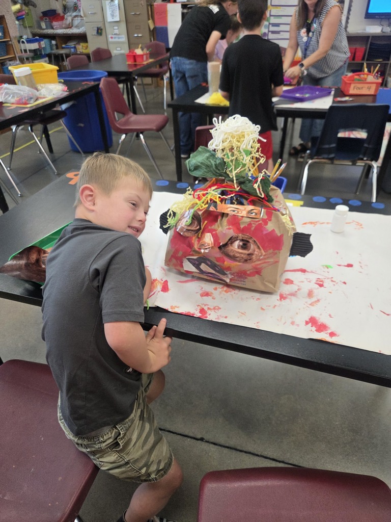 Student showing off his pumpkin 