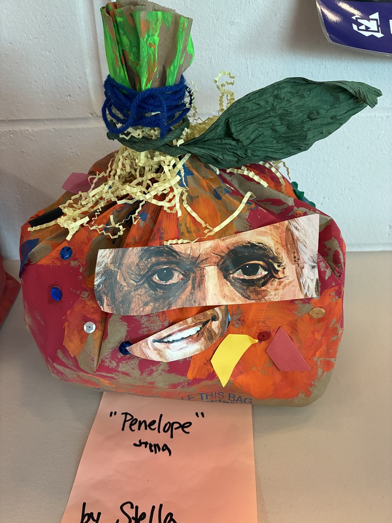 Paper Pumpkin with collaged face parts. 
