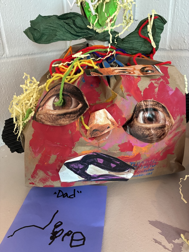 Paper Pumpkin with collaged face parts. 