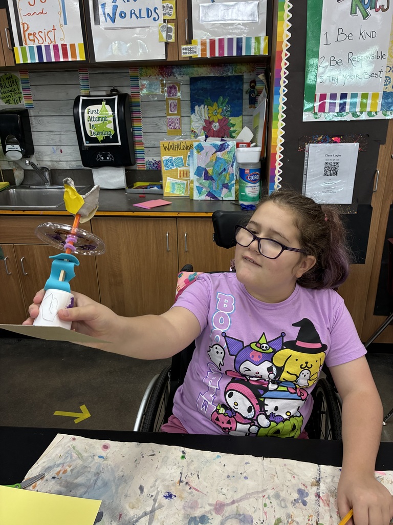 Student showing her sculpture 