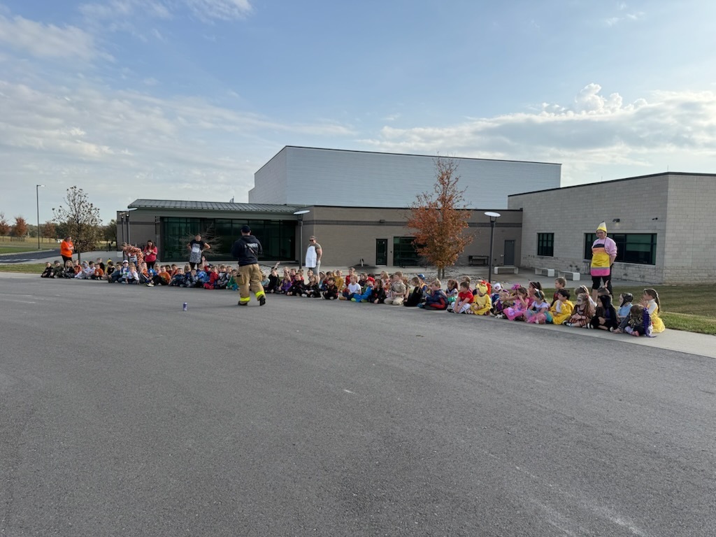 Kindergarten listening to the Tonganoxie Fire Department give a presentation.