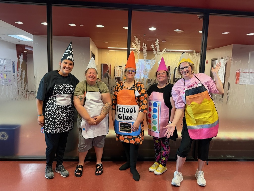 The Kindergarten teachers dressed as school supplies.