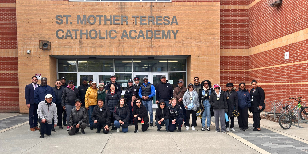 Group photo in front of St. Mother Teresa School