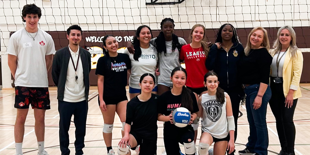 Group photo of SJCS students and staff with Mason