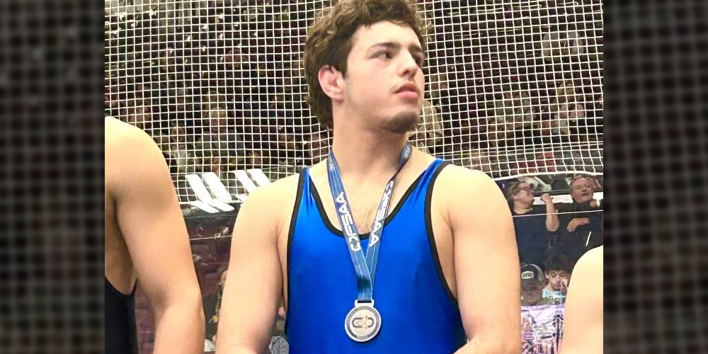 Photo of Bernardo wearing his silver medal