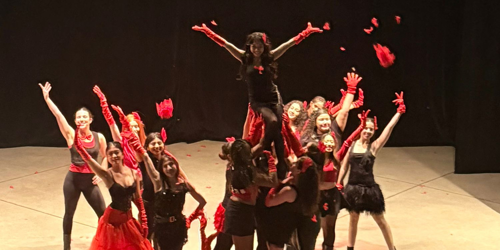 Photo of Loretto College School students performing on stage