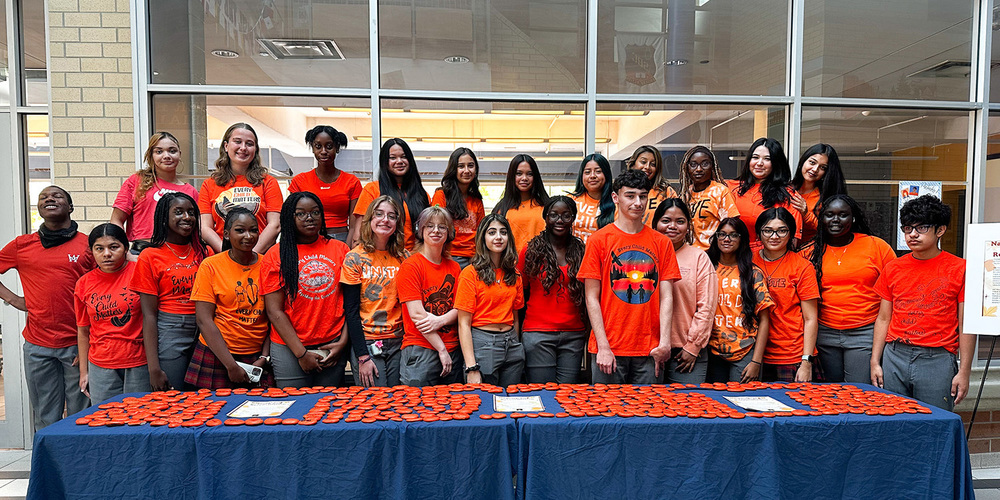 Group photo of St. Basil-the-Great students with the rocks they painted