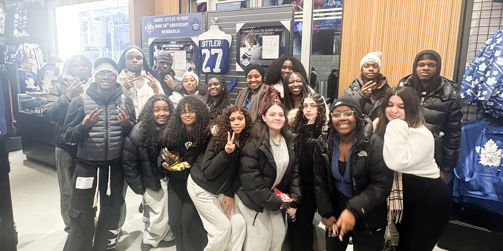 Group photo of Father Henry Carr students at the game