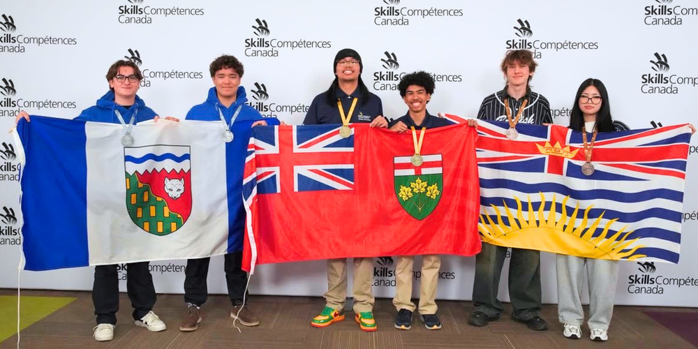 Students holding provincial flags