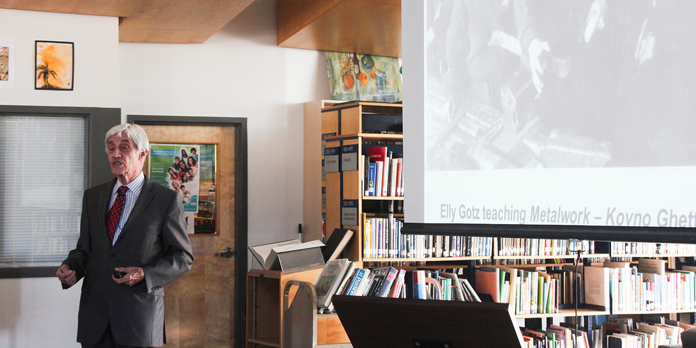 Photo of Elly speaking to St. Oscar Romero students