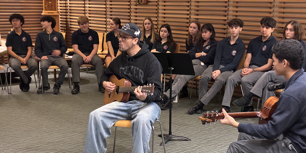 Photo of Justin teaching Father John Redmond students during the session