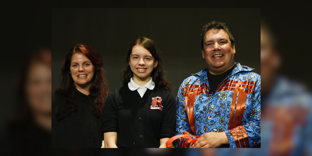 3 people smiling at camera, black background