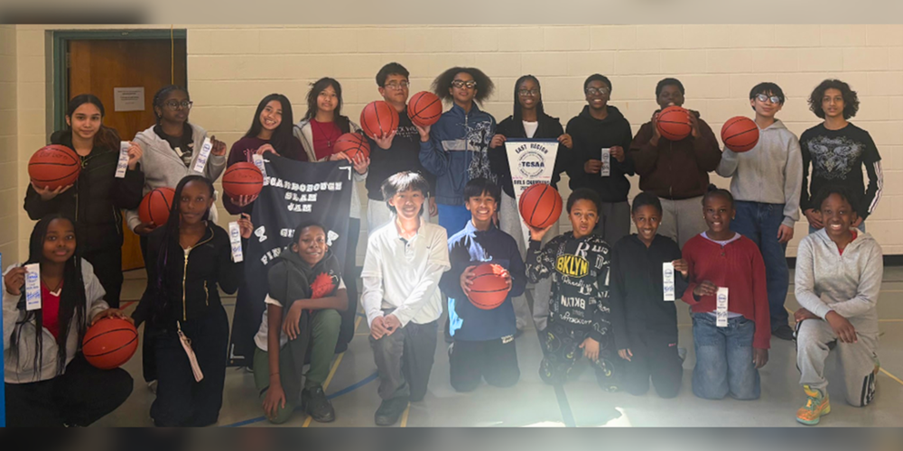 Group photo of students with basketballs.