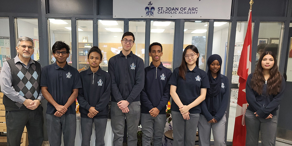 Group photo of SJOA students who took the test, along with the head of the Math department