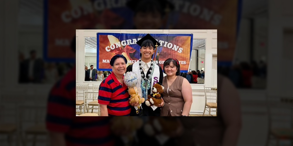 Photo of Mikush at graduation in his graduating robes posing with his parents