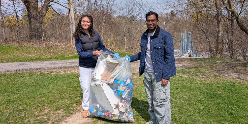 Photo of Bishop Allen students cleaning up the outdoors
