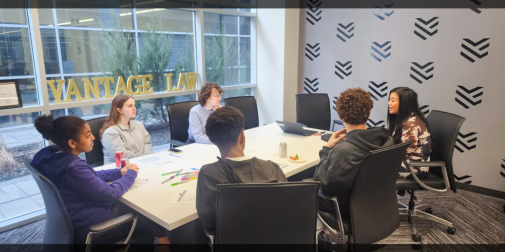 Photo of MPSJ students discussing together at Vantage Law