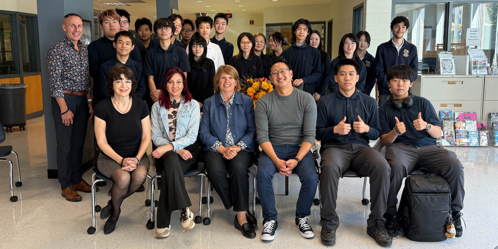 Group photo of students and faculty in a school