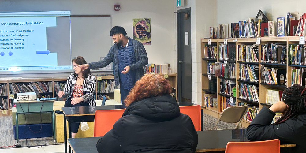 Photo of parents listening to Mr. Persad and Ms. Harispuru's presentation