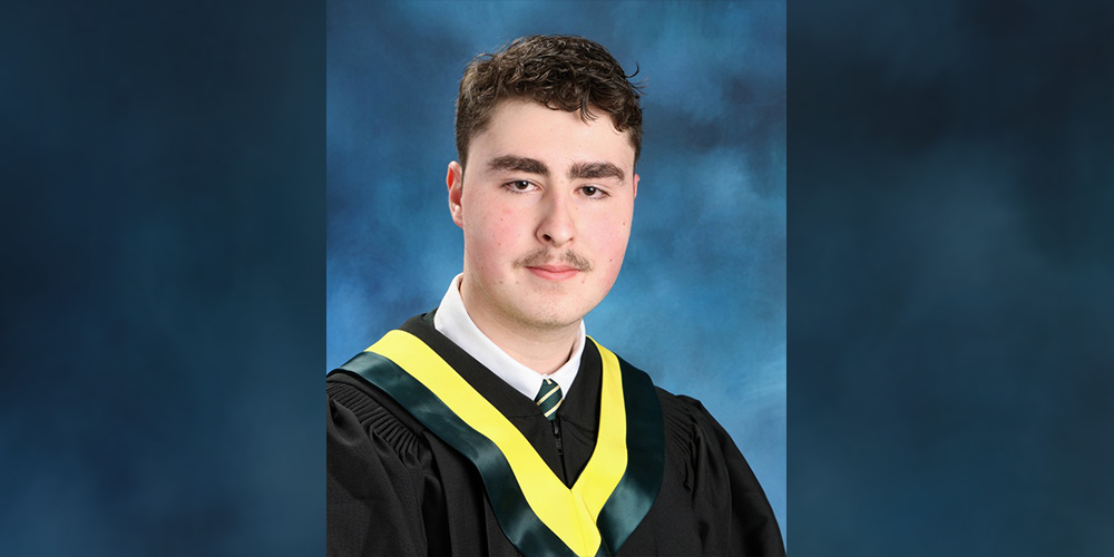 School photo of Gabriel in his graduating robes