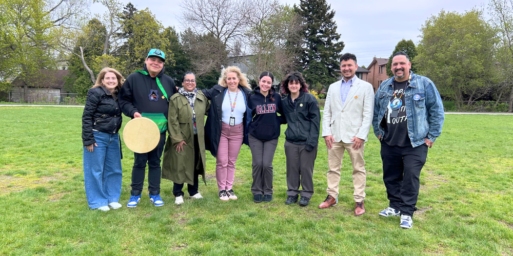 Group of students and faculty outdoors.