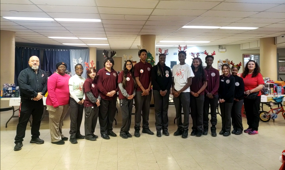 group photo of students and faculty with reindeer ears