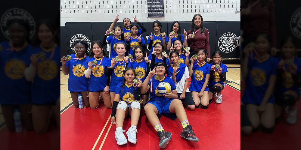 Group photo of St. Margaret Girls Volleyball Team with their Coach, in their team jerseys and showing off their medals