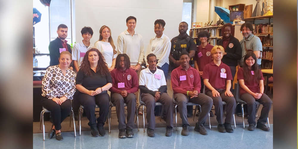 Group photo of students in a library