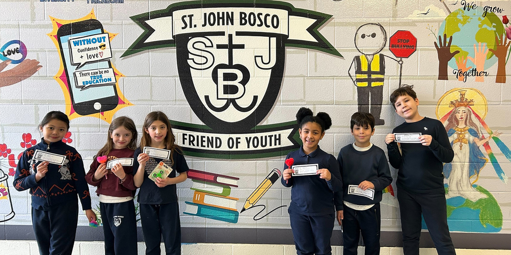 Photo of St. John Bosco students holding GOTCHA cards