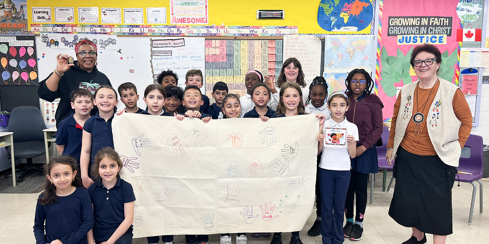 Group photo of students with Ms. Balthazaar and Diane Montreuil