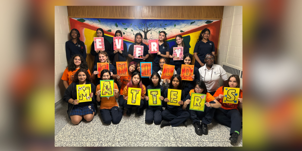 Group of students holding letters that spell "EVERY CHILD MATTERS"
