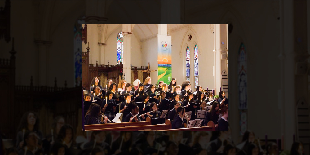 Photo of SJCS students performing in the Church