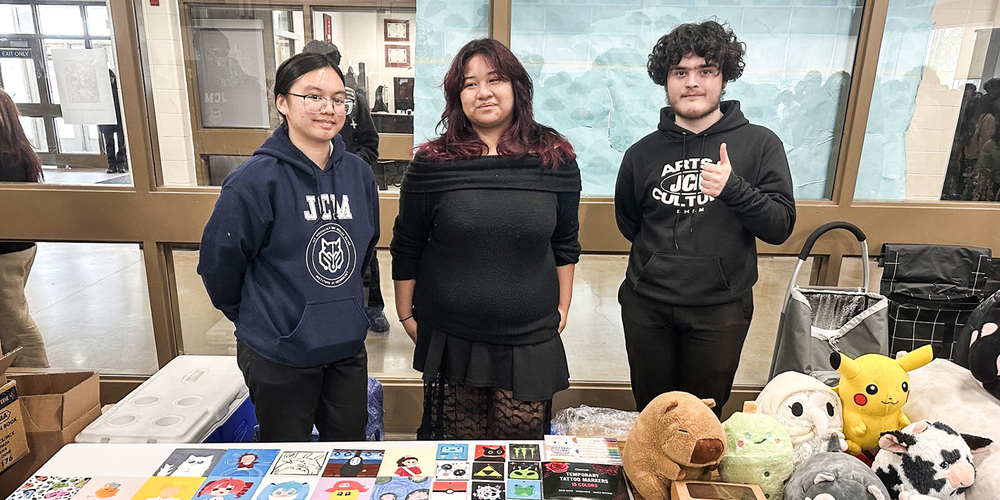 Photo of JCM students with their wares at the marketplace