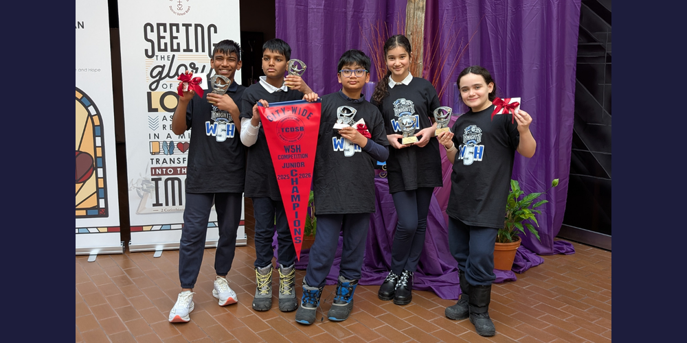 5 students posing with w5h 2026 Champions banner