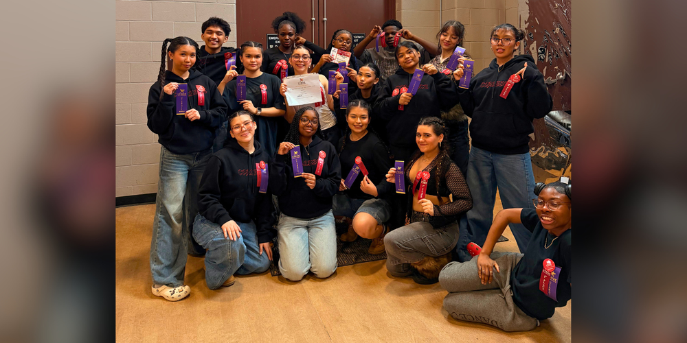 Group photo of girls holding awards.