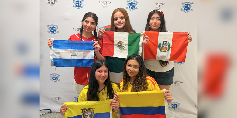 5 students holding flags
