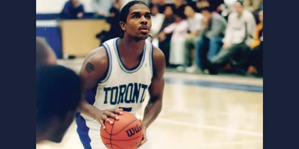 A basketball player about to throw  a basketball. 