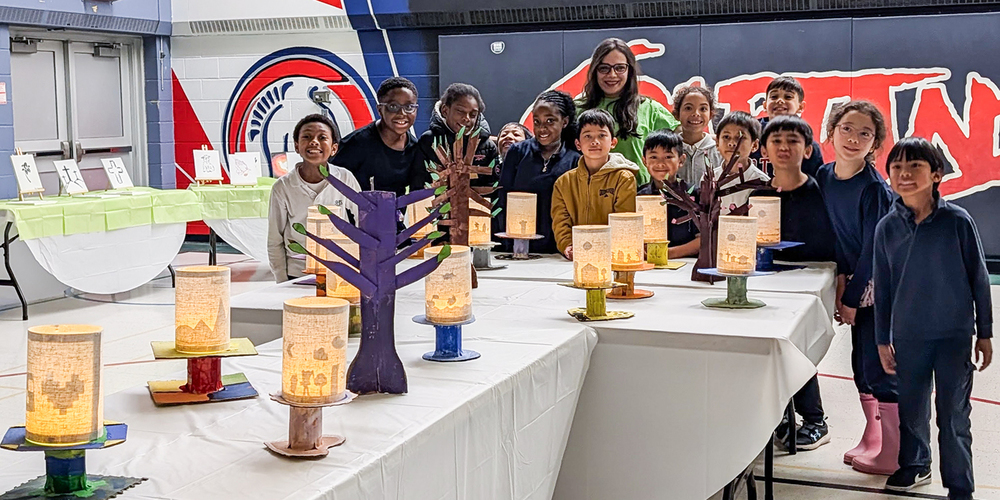 Photo of Blessed Trinity students and staff with the exhibits they created