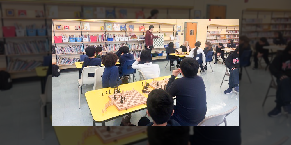 Photo of Blessed Trinity students playing chess during the club