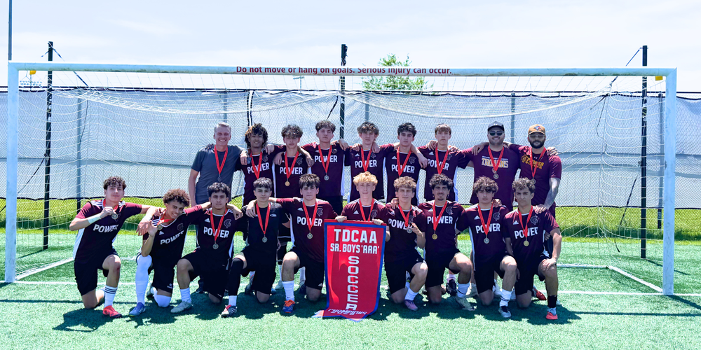 Group photo of soccer players with TDCAA Award