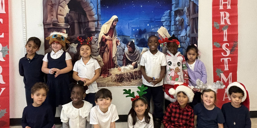 Photo of St. Benedict Kindergarten students in front of the Nativity painting
