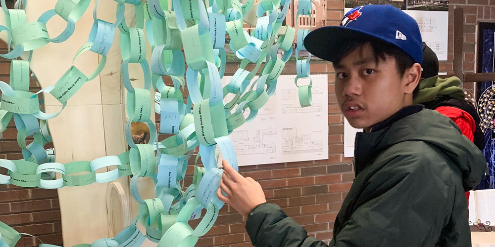 Photo of one of the students looking at the tree