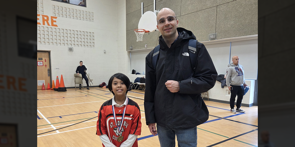 Photo of Adam with his coach