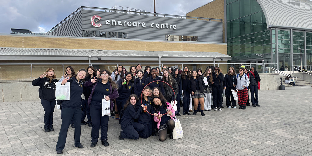 Group photo of Loretto College school students in front of the Enercare Centre building
