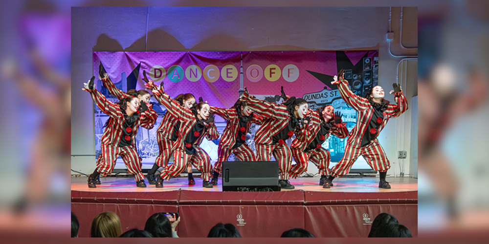 Students dressed as clowns performing a dance.