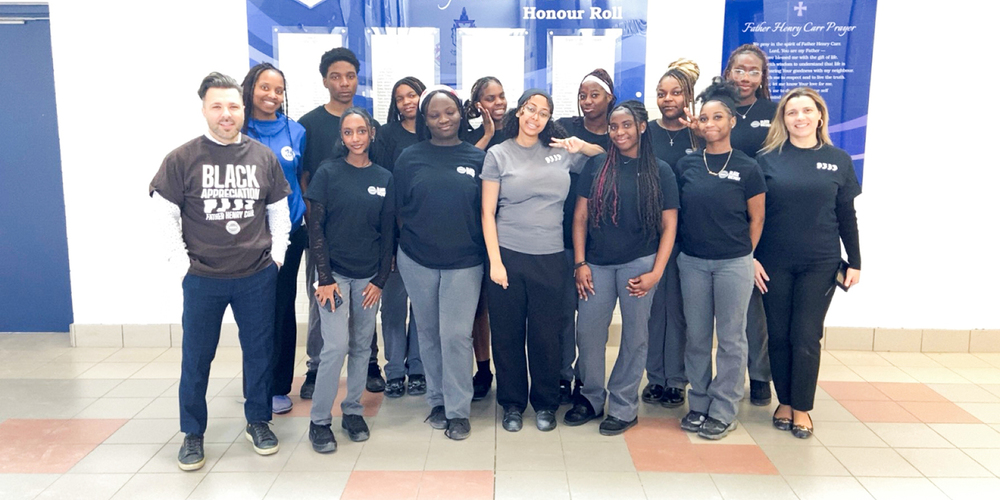 Group photo of the Father Henry Carr Black Students Association with their lead teachers
